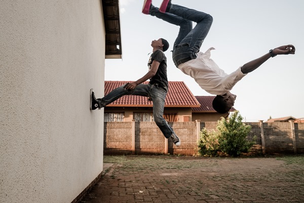 Marco Casino, Kwesine, Johannesburg. Chabedi Thulo and a friend flip on the wall training for train surfing combo